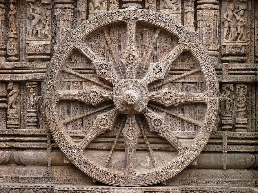 Intricate Stone Chakra Carving on the Konark Sun Temple Facade HD wallpaper