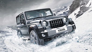 Mahindra Thar SUV Driving Through Snowy Mountain Terrain HD wallpaper