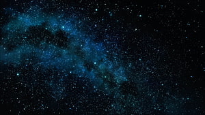 Deep Space Star Field with Blue Nebula and Dark Dust Lanes Against Black Sky HD wallpaper