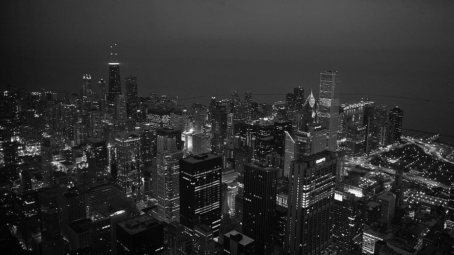 Monochrome Aerial View of Chicago Skyline at Night with Dense Urban Lights HD wallpaper