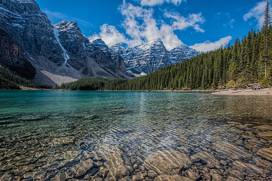 Turquoise Waters of Moraine Lake Framed by Snow-Capped Canadian Rockies HD wallpaper