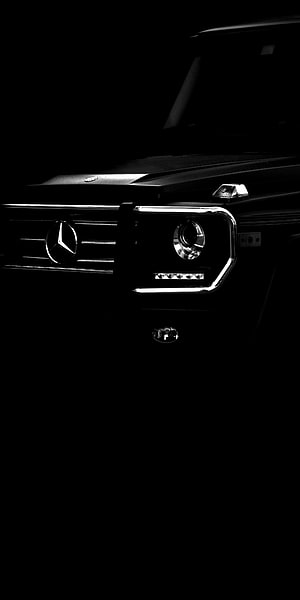 Mercedes-Benz G-Class Front Grille and Headlight Detail in Dramatic Black and White Lighting HD phone wallpaper