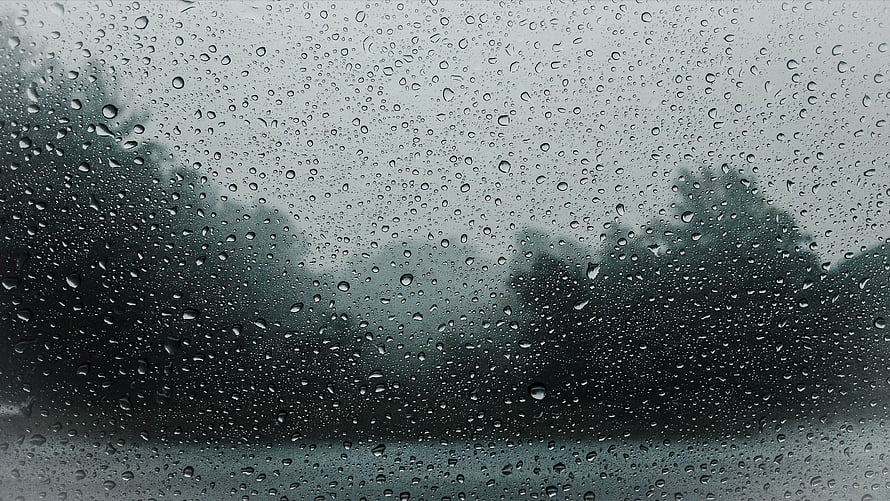 Moody Raindrops on Glass with Blurred Dark Trees in Background HD wallpaper