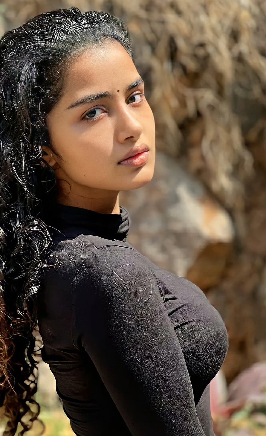 Portrait of a woman with long curly hair wearing a black top outdoors, Anupama parameswaran, actress, anupama_parameswaran, mallu, anupamaparameswaran, Tollywood HD phone wallpaper