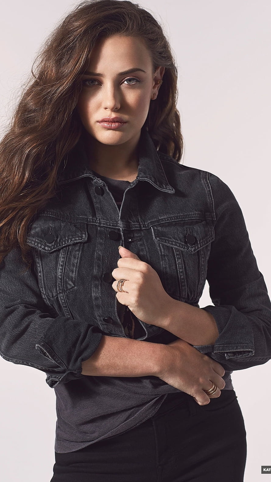 Katherine Langford in a Black Denim Jacket with Long Wavy Hair HD phone wallpaper