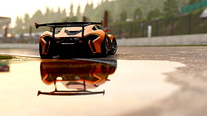 McLaren P1 GTR Rear View on Wet Track with Reflection HD wallpaper