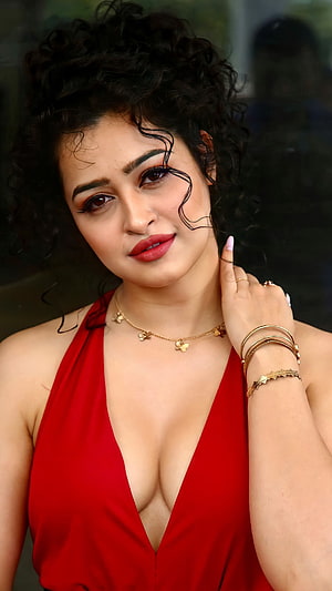 Apsara Rani in a Red Halter Dress with Gold Jewelry and Curly Hair HD phone wallpaper