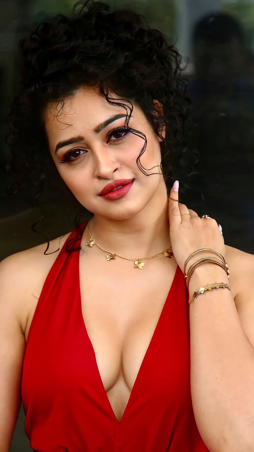 Apsara Rani in a Red Halter Dress with Gold Jewelry and Curly Hair HD phone wallpaper