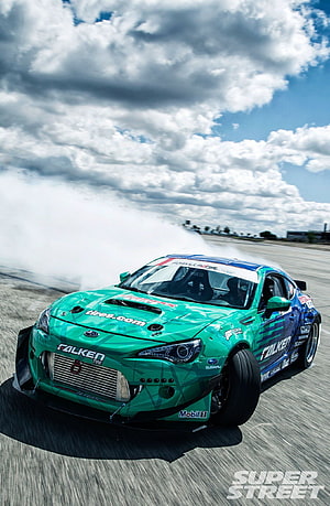 Green Subaru BRZ Drift Car Performing Burnout on Race Track HD phone wallpaper