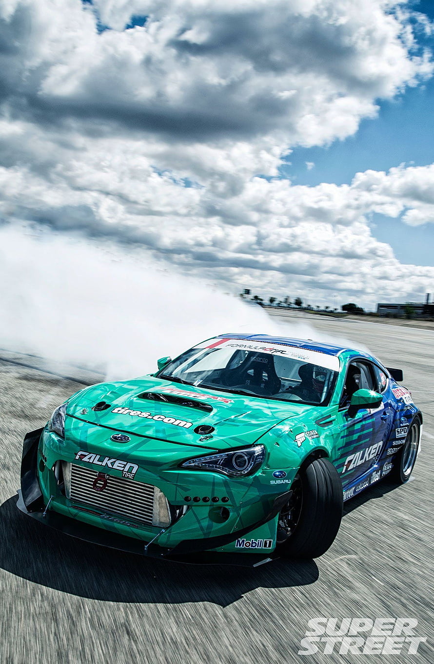 Green Subaru BRZ Drift Car Performing Burnout on Race Track HD phone wallpaper
