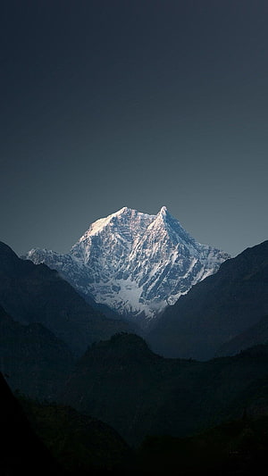 Mount Kailash Snow-Capped Peak Rising Above Dark Rugged Valleys at Dawn HD phone wallpaper