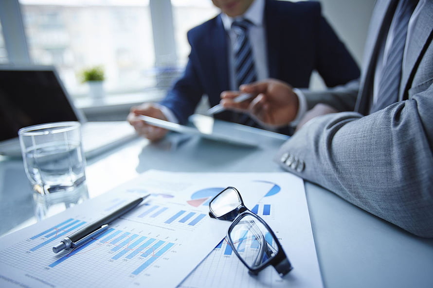 Corporate Meeting with Financial Charts and Business Documents on Office Desk HD wallpaper