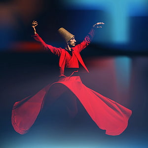 Whirling Dervish in Red Robe Performing Sufi Dance on Stage HD phone wallpaper