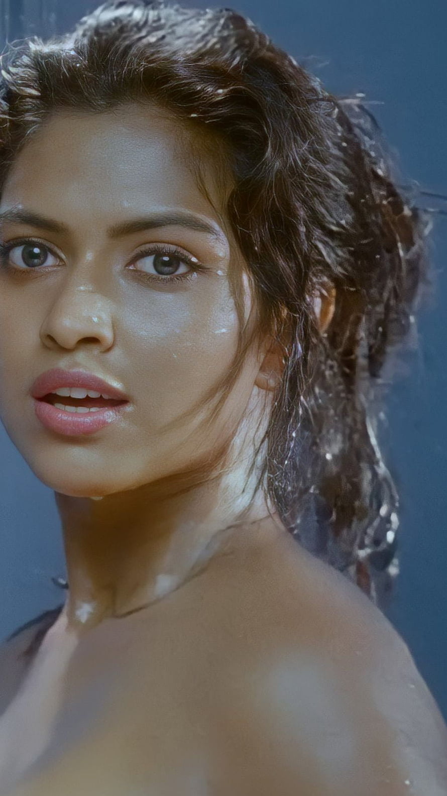 Amala Paul Wet Hair Portrait with Glistening Skin and Intense Gaze HD phone wallpaper