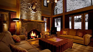 Cozy Log Cabin Living Room With Stone Fireplace And Snowy Forest View HD wallpaper