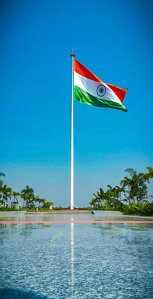 Indian National Flag Flying High On Tall Pole Against Blue Sky HD phone wallpaper