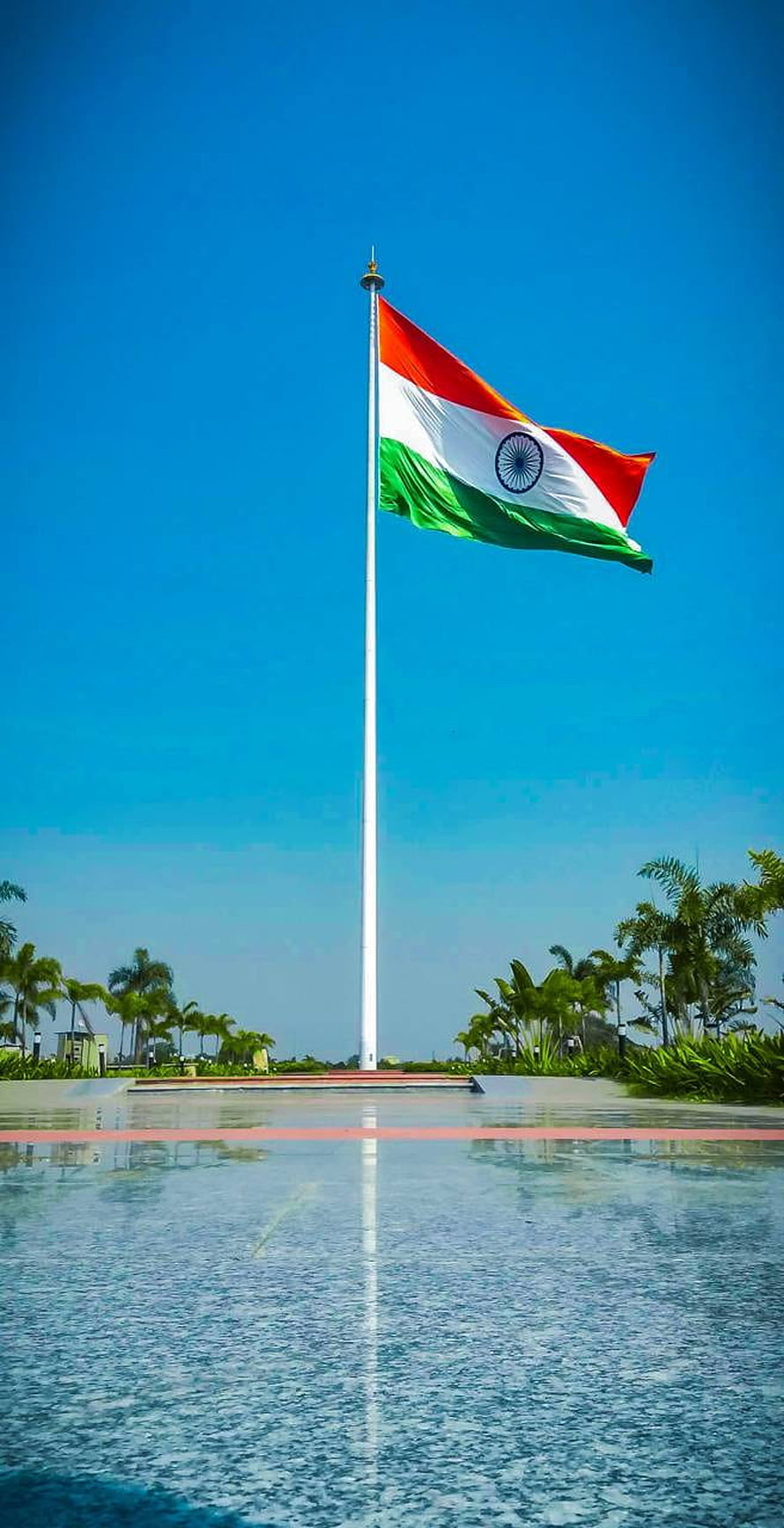 Indian National Flag Flying High On Tall Pole Against Blue Sky HD phone wallpaper