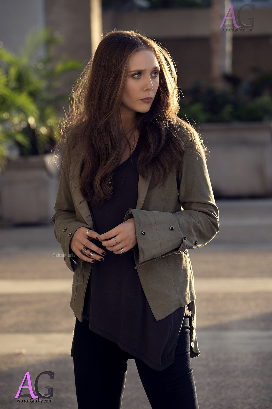 Elizabeth Olsen as Wanda Maximoff in a casual olive jacket and dark top HD phone wallpaper