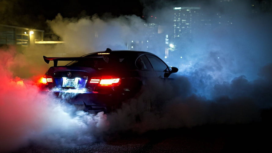 Black BMW M3 E92 Drifting at Night with Smoke and Neon Lights HD wallpaper