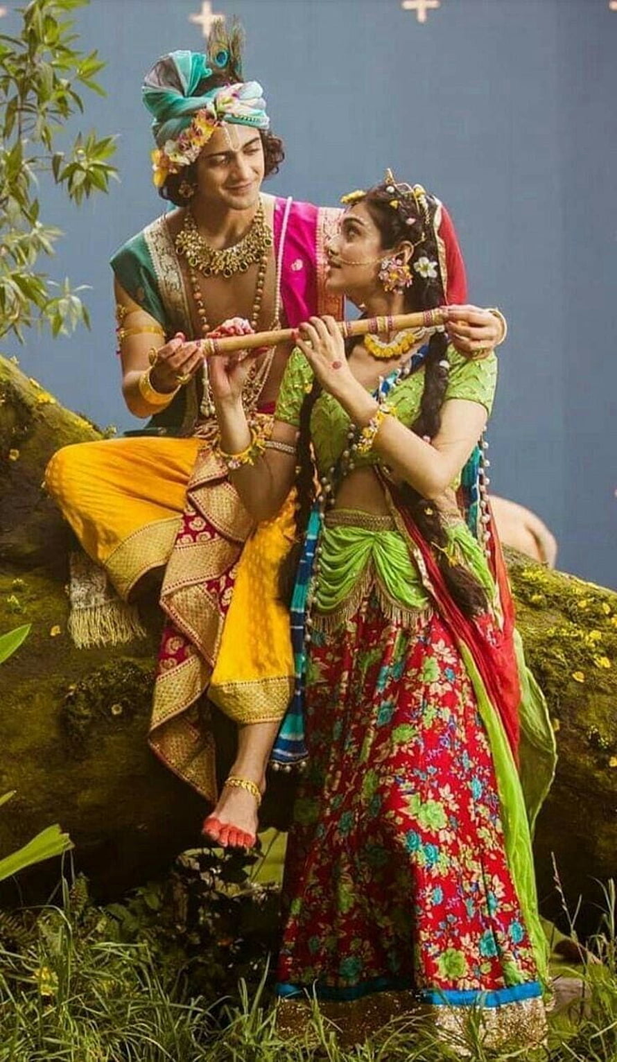 Radha Krishna Playing Flute in Vibrant Traditional Indian Attire HD phone wallpaper