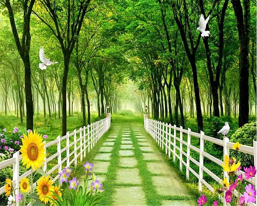 Serene Garden Path with White Fence, Sunflowers, and Flying Doves in a Lush Green Forest HD wallpaper