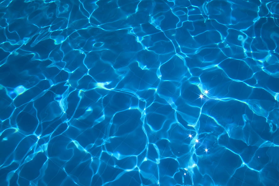 Cascading Blue Water Surface with Sunlight Reflections and Ripples HD wallpaper