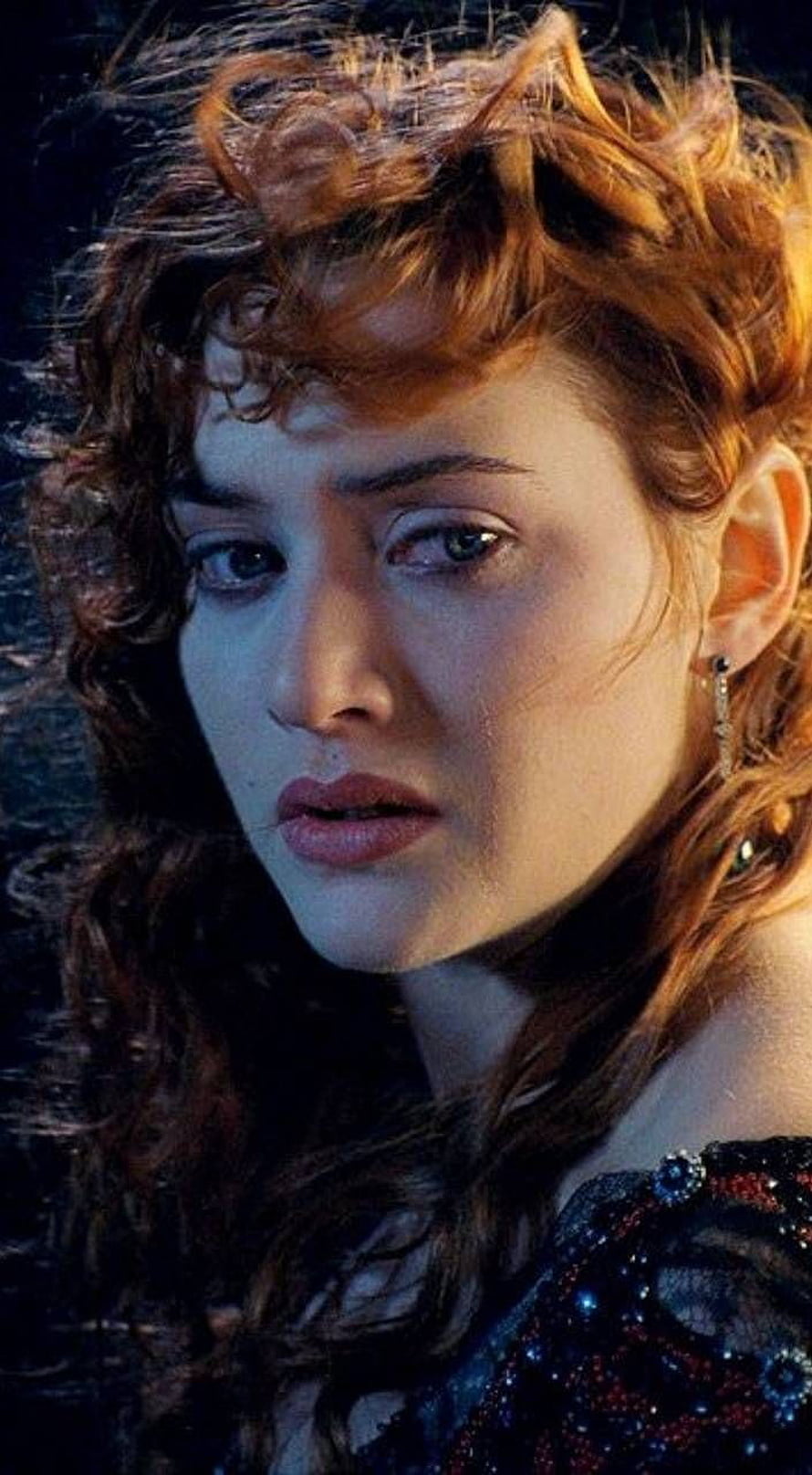 Kate Winslet in Titanic with curly auburn hair and dramatic cinematic lighting HD phone wallpaper
