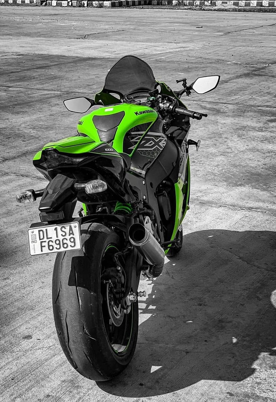 Kawasaki ZX-10R Sportbike in Lime Green and Black on Concrete Surface HD phone wallpaper