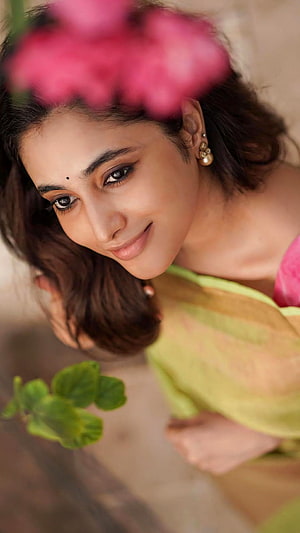 Priyanka Mohan Portrait with Pink Flowers and Green Leaves HD phone wallpaper