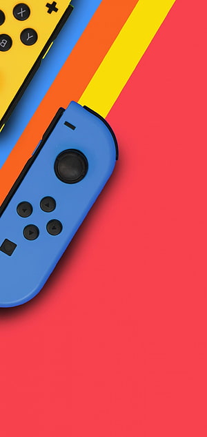 Nintendo Switch Joy-Con Controllers on Vibrant Diagonal Striped Background HD phone wallpaper