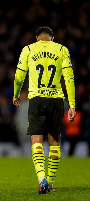 Jude Bellingham Walking on the Pitch in a Neon Yellow Borussia Dortmund Kit HD phone wallpaper