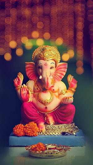 Ekdanta Ganesha Statue with Marigold Flowers and Golden Jewelry HD phone wallpaper