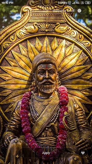 Golden Statue of Chhatrapati Shivaji Maharaj with Flower Garland and Sunburst Halo HD phone wallpaper