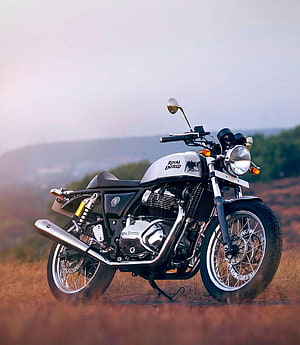 Royal Enfield Continental GT 650 Classic Motorcycle on a Scenic Hilltop Trail HD phone wallpaper