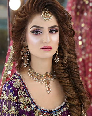 Elegant Indian Bride in Purple Embroidered Lehenga with Traditional Jewelry and Makeup HD phone wallpaper