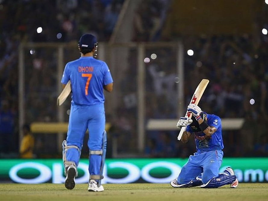 MS Dhoni and Rohit Sharma Celebrating Victory in Blue Cricket Jerseys HD wallpaper