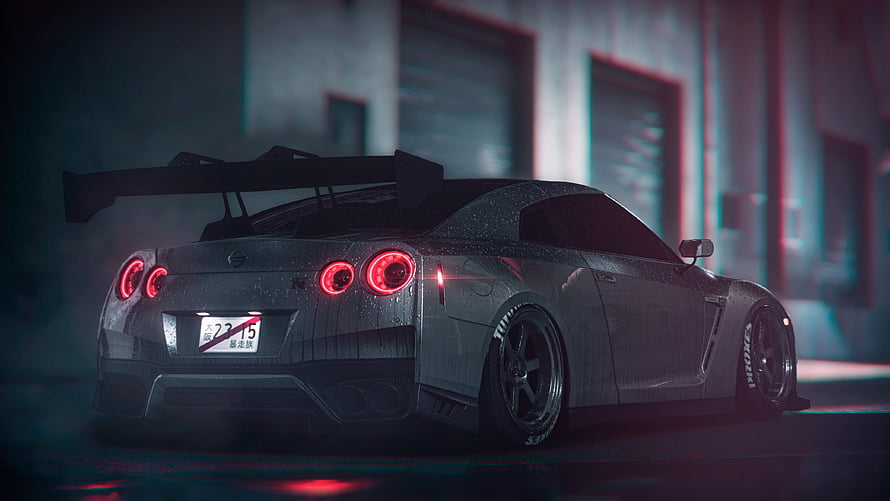 Nissan Skyline GT-R R34 Rear View with Large Wing in Dark Industrial Setting HD wallpaper