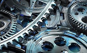 Intricate 3D Render of Interlocking Chrome Gears and Mechanical Cogwheels HD wallpaper