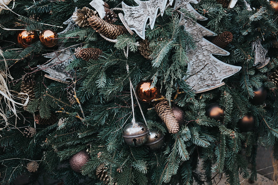 Rustic Christmas Garland With Pinecones, Bells, and Wooden Tree Ornaments HD wallpaper