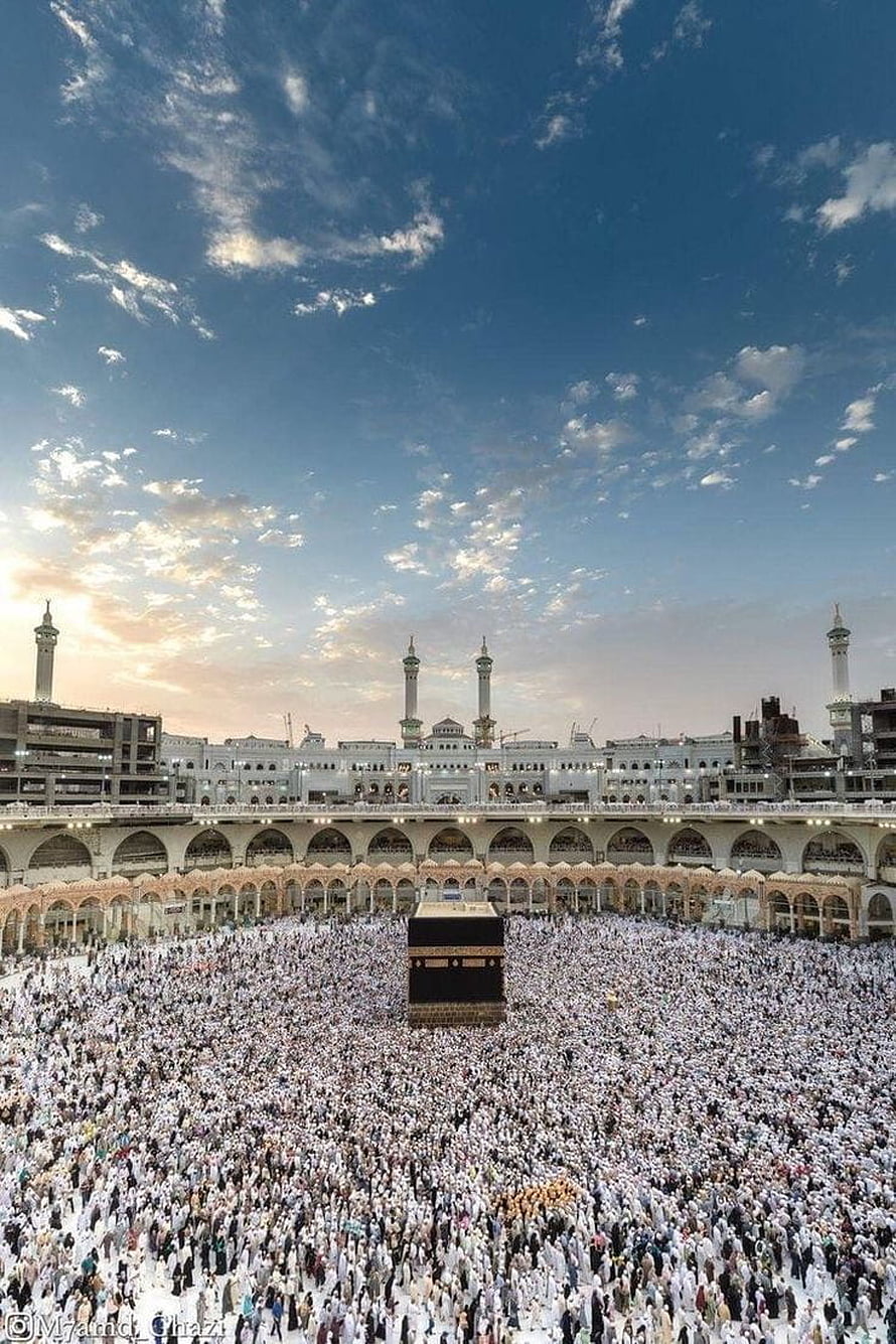 Massive Pilgrim Gathering at the Kaaba in Mecca Under a Vast Blue Sky HD phone wallpaper
