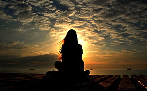 Silhouette of a Woman Sitting on a Wooden Pier Watching a Golden Sunset Over the Ocean, Alone Sad : Alone Sad Girl, Lonely Girl HD wallpaper