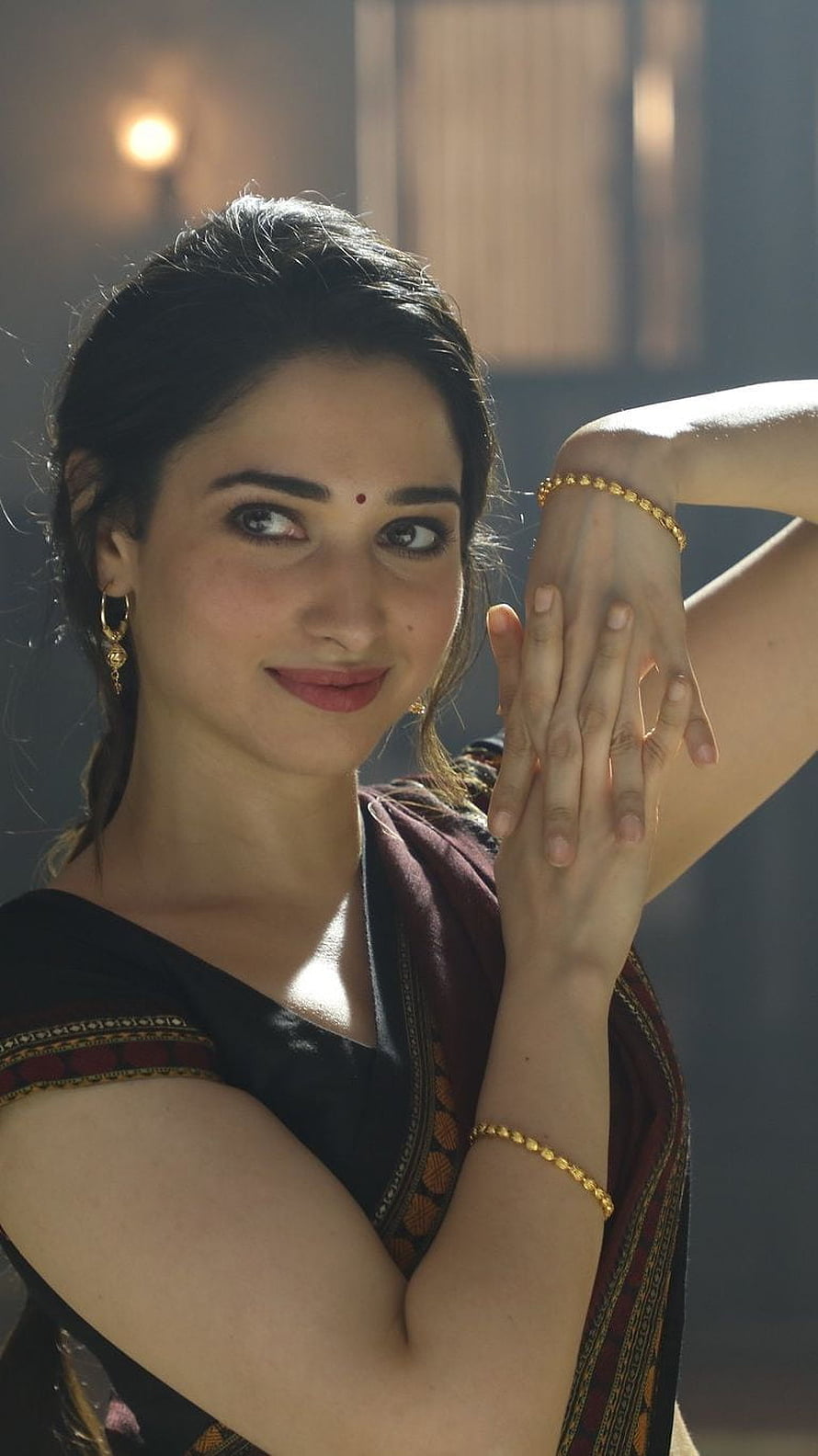 Tamannaah Bhatia in a black saree with gold jewelry posing gracefully, Tamanna Bhatia, tamanna, bhatia, model, telugu actress HD phone wallpaper