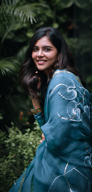Woman in Teal Floral Dress Smiling in Garden, Kalyani Priyadarshan, lip HD phone wallpaper