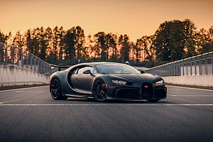 Matte Black Bugatti Chiron Super Sport on a Racetrack at Sunset HD wallpaper