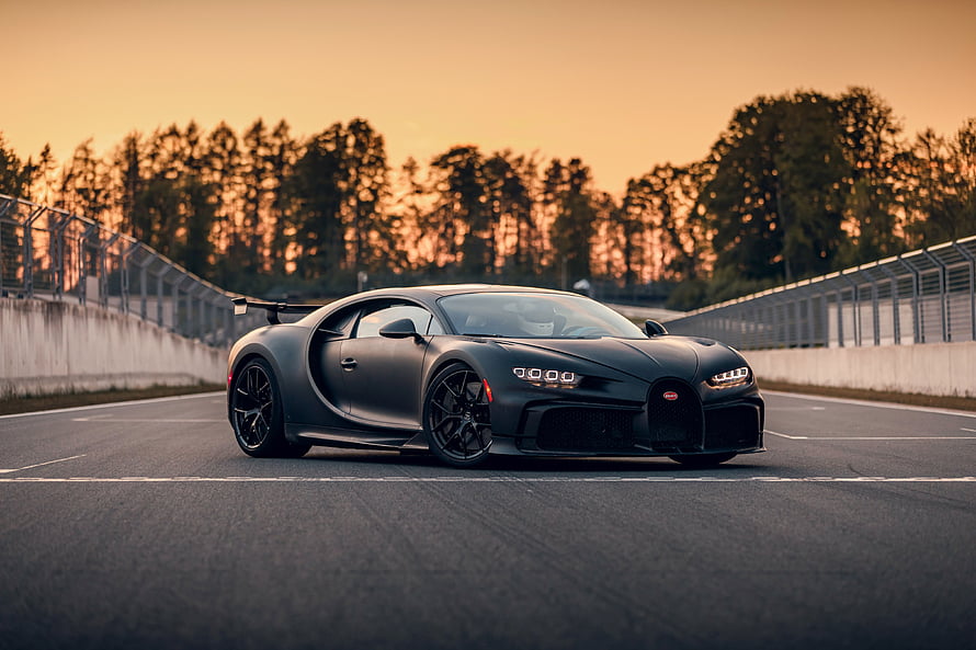 Matte Black Bugatti Chiron Super Sport on a Racetrack at Sunset HD wallpaper