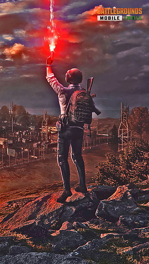 PUBG Mobile India Character Holding Red Flare on Rocky Cliff at Sunset HD phone wallpaper