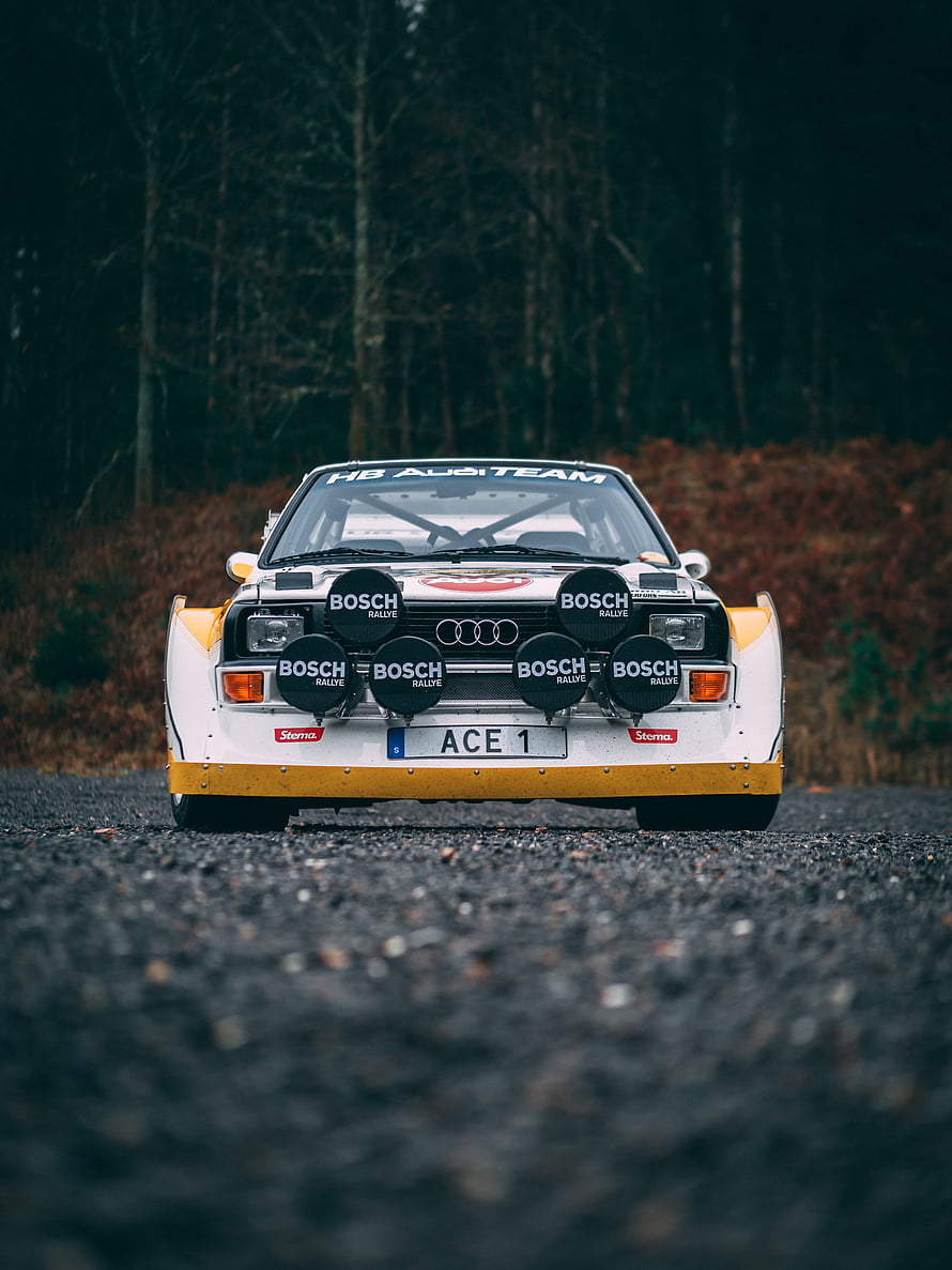 Classic Audi Quattro Rally Car with Bosch Lights on Forest Road HD phone wallpaper