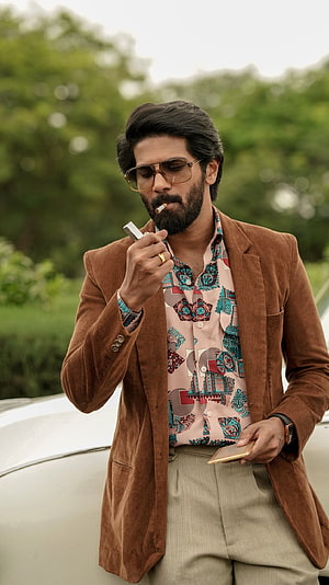 Dulquer Salman in Kurup Malayalam Film Still Wearing Brown Corduroy Blazer and Aviator Sunglasses, KURUP, malayalam movie, dulquer salman HD phone wallpaper
