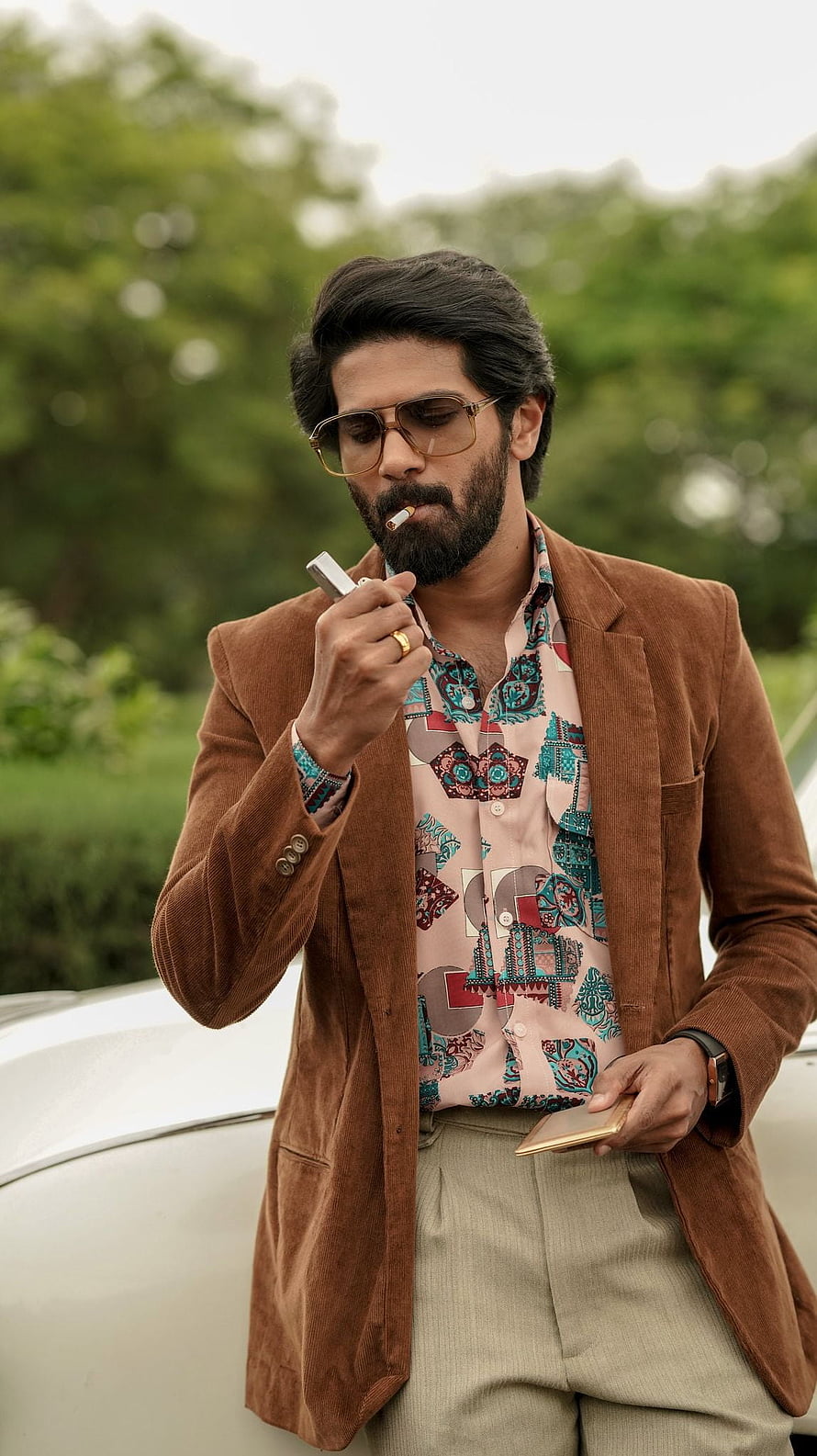 Dulquer Salman in Kurup Malayalam Film Still Wearing Brown Corduroy Blazer and Aviator Sunglasses, KURUP, malayalam movie, dulquer salman HD phone wallpaper