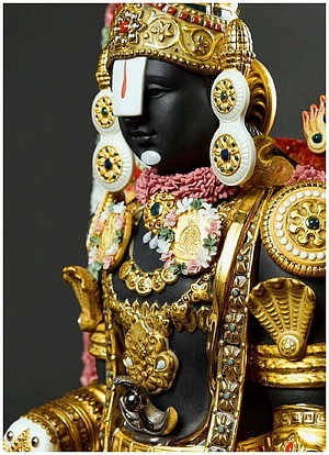 Ornate Gold and Black Venkateswara Deity Statue with Floral Garland and Jeweled Crown HD phone wallpaper